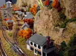 All about model railroad buildings – planning for them, kits, kitbashing, scratchbuilding, materials required, lighting your structures, interior details, how to install them onto your layout.