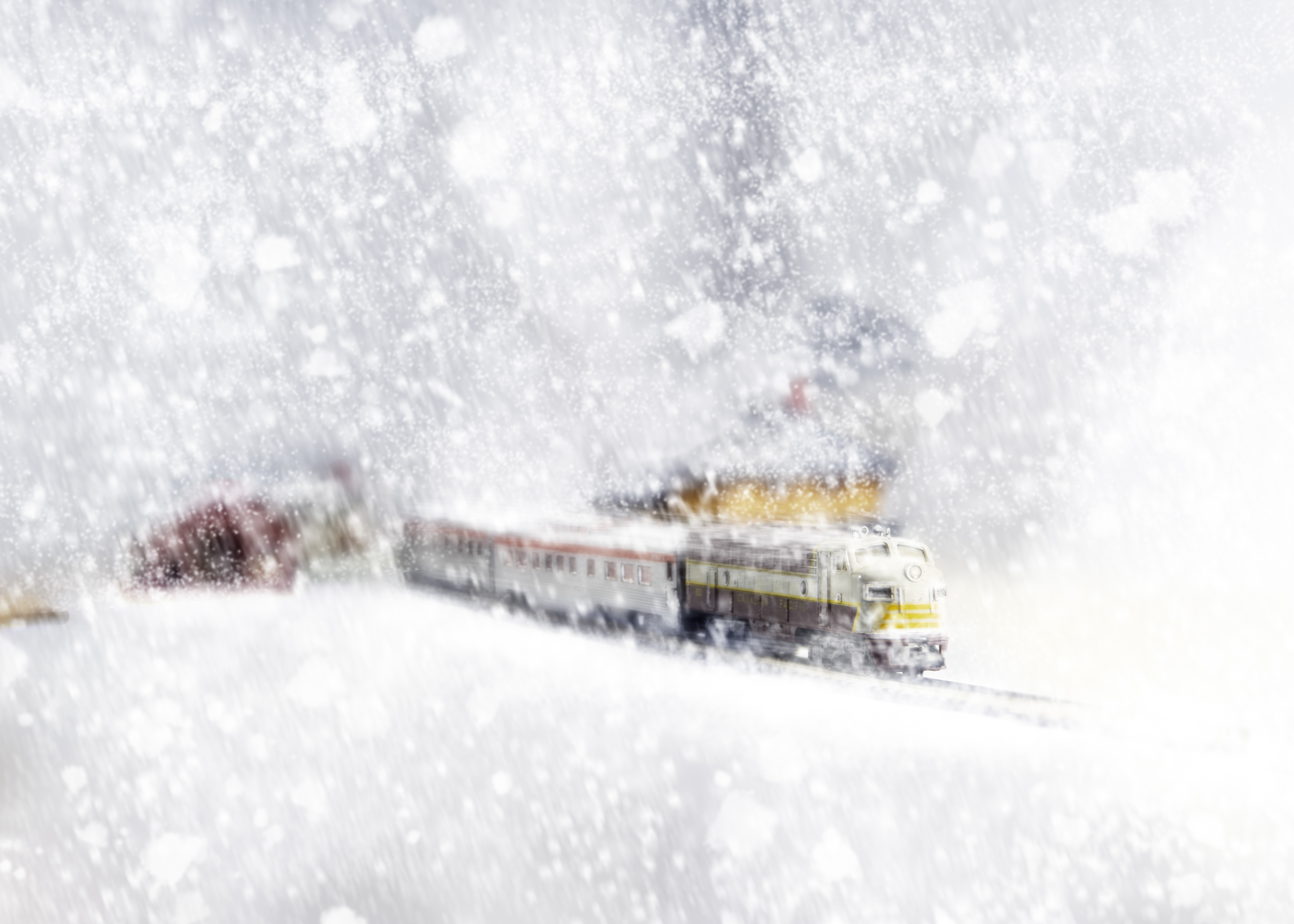 Winter train pushing on through a blizzard