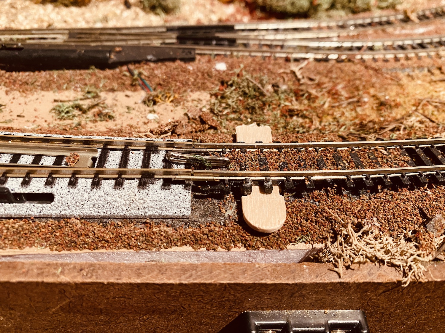 Model Railroad Track Repair: I used small pieces of wood to raise the existing Atlas track so the rails would be the same height as the Kato replacement turnout.
